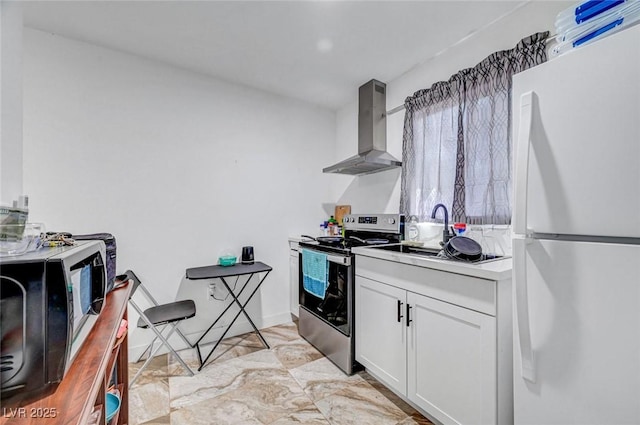 872 N Linn Ln, Las Vegas, NV 89110 - kitchen with freestanding refrigerator, wall chimney exhaust hood, stainless steel electric stove, black microwave, and white cabinetry