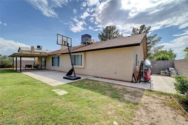 872 N Linn Ln, Las Vegas, NV 89110 - back of property with stucco siding, central air condition unit, and a patio