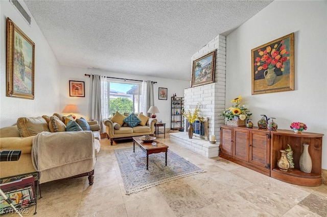 872 N Linn Ln, Las Vegas, NV 89110 - living area featuring a textured ceiling and a brick fireplace