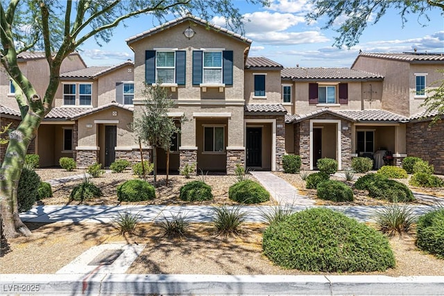 3188 Via Da Vinci, Henderson, NV 89044 - view of front of property with stucco siding, stone siding, and a tiled roof