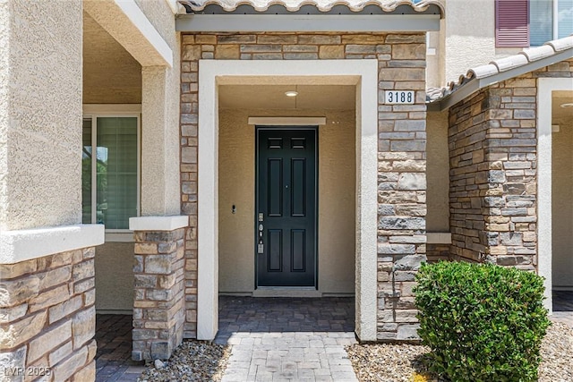 3188 Via Da Vinci, Henderson, NV 89044 - view of exterior entry with stone siding and stucco siding