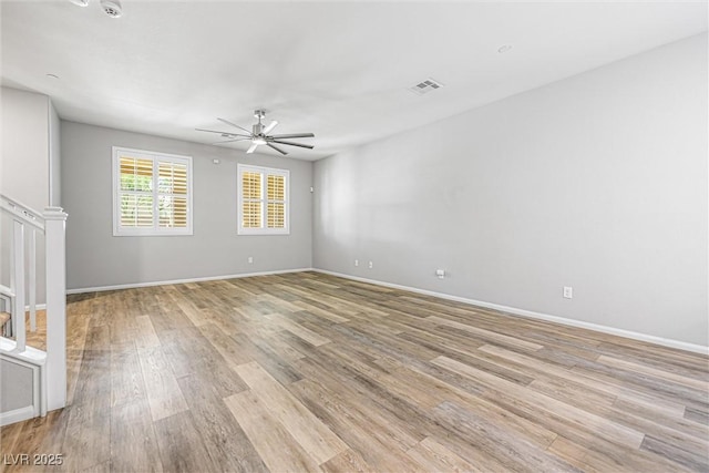 3188 Via Da Vinci, Henderson, NV 89044 - unfurnished room featuring light wood finished floors, ceiling fan, stairway, and baseboards