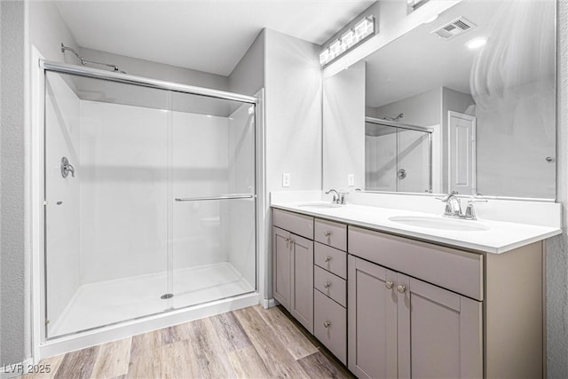 3188 Via Da Vinci, Henderson, NV 89044 - full bath with wood finished floors, a shower stall, and double vanity