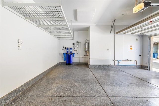 3188 Via Da Vinci, Henderson, NV 89044 - garage with water heater, a garage door opener, and baseboards