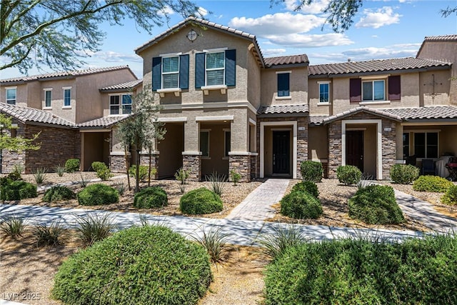 3188 Via Da Vinci, Henderson, NV 89044 - view of front of home with stone siding, stucco siding, and a tiled roof