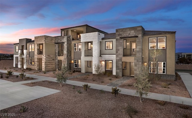 871 Apatite Pl Lot 54, Henderson, NV 89011 - contemporary home with a balcony and stone siding
