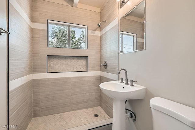 1404 Atlantic St, Las Vegas, NV 89104 - bathroom with a tile shower and toilet