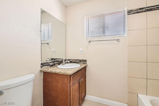1404 Atlantic St, Las Vegas, NV 89104 - bathroom with toilet, vanity, and a bathtub