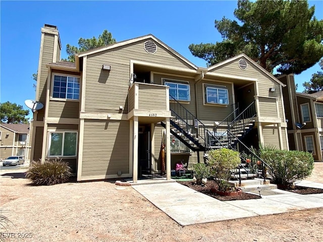 4682 Leeann Ln, Las Vegas, NV 89121 - view of front facade featuring stairway and a chimney