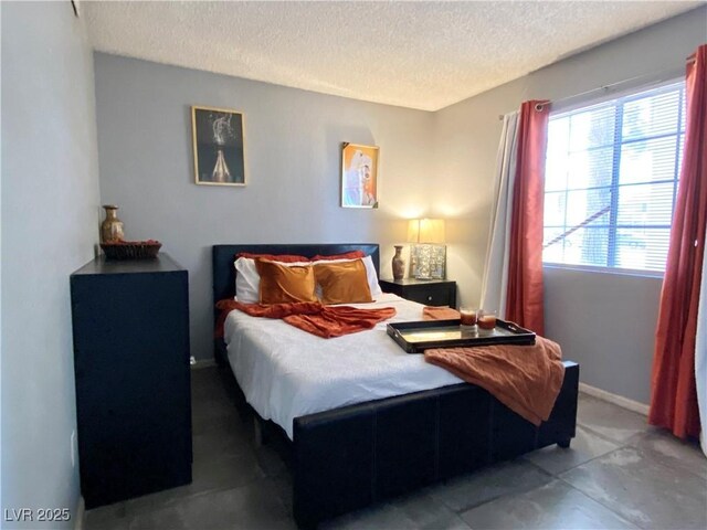 4682 Leeann Ln, Las Vegas, NV 89121 - bedroom featuring a textured ceiling and baseboards