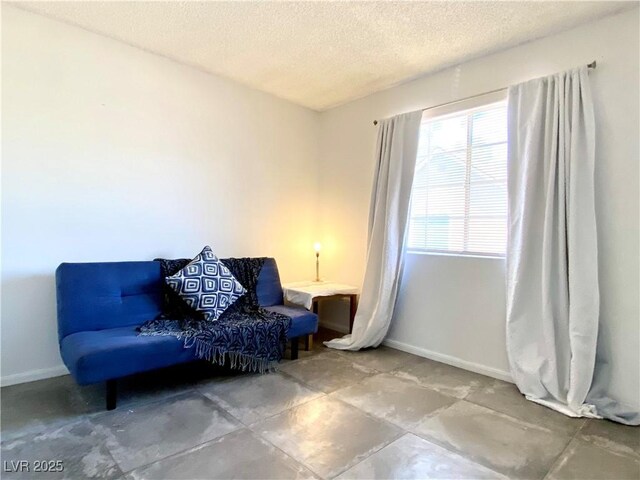 4682 Leeann Ln, Las Vegas, NV 89121 - sitting room featuring baseboards and a textured ceiling