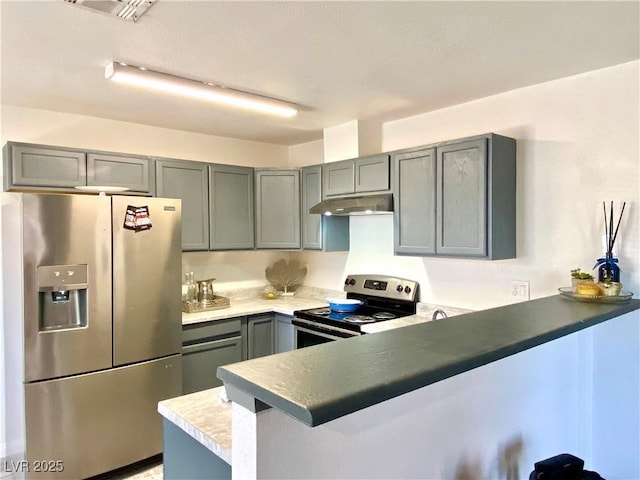 4682 Leeann Ln, Las Vegas, NV 89121 - kitchen featuring stainless steel fridge with ice dispenser, electric range, a peninsula, under cabinet range hood, and gray cabinetry