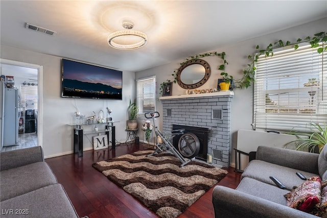 300 N 14th St, Las Vegas, NV 89101 - living room with wood finished floors, a brick fireplace, and baseboards