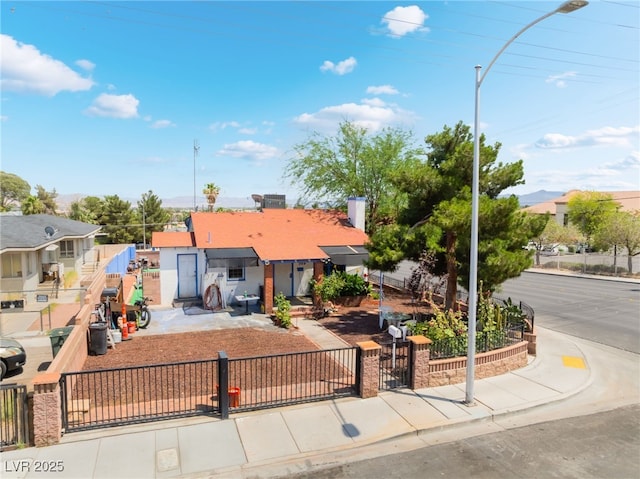 300 N 14th St, Las Vegas, NV 89101 - view of front of home featuring a fenced front yard, a gate, and a residential view