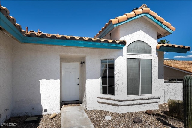 3236 Manzanita Ln, Laughlin, NV 89029 - entrance to property with a tile roof and stucco siding