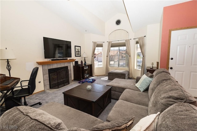 3236 Manzanita Ln, Laughlin, NV 89029 - carpeted living room with a tiled fireplace and high vaulted ceiling