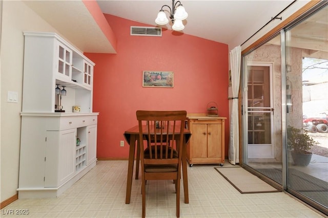 3236 Manzanita Ln, Laughlin, NV 89029 - dining space with vaulted ceiling, a chandelier, and baseboards