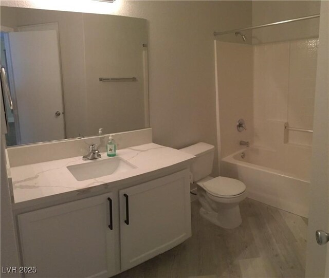 4555 E Sahara Ave Unit 226, Las Vegas, NV 89104 - full bathroom featuring vanity, tub / shower combination, toilet, and wood finished floors