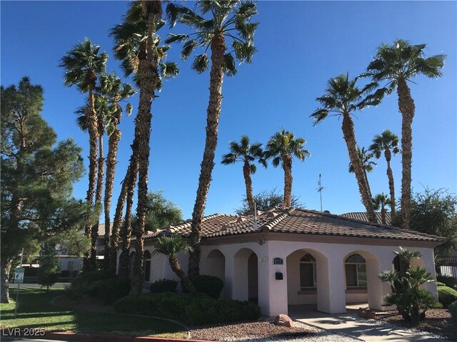 4555 E Sahara Ave Unit 226, Las Vegas, NV 89104 - view of front of house featuring stucco siding and a tile roof