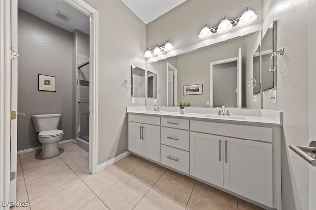 6192 Lautman Ridge Ct, Las Vegas, NV 89141 - full bath with double vanity, toilet, a stall shower, tile patterned flooring, and baseboards