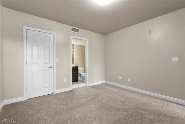 8000 Badura Ave Unit 2028, Las Vegas, NV 89113 - unfurnished bedroom featuring carpet floors, baseboards, and ensuite bath
