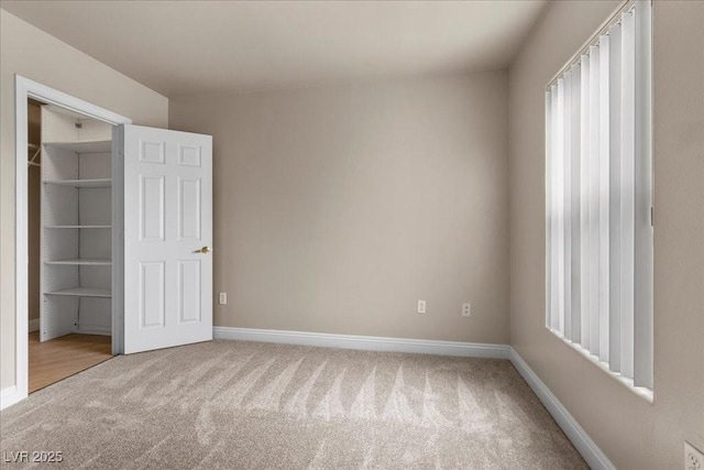 8000 Badura Ave Unit 2028, Las Vegas, NV 89113 - unfurnished bedroom featuring carpet flooring and baseboards