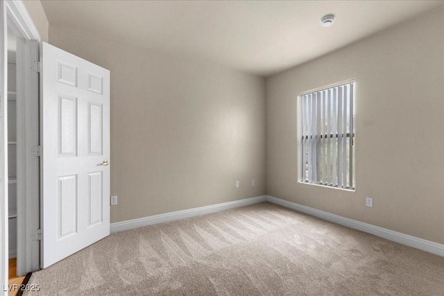 8000 Badura Ave Unit 2028, Las Vegas, NV 89113 - carpeted spare room with baseboards and a smoke detector