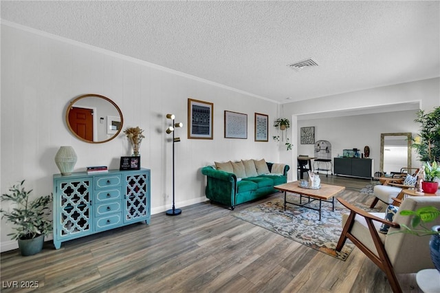 4419 Lorna Pl, Las Vegas, NV 89107 - living area featuring a textured ceiling, wood finished floors, ornamental molding, and baseboards
