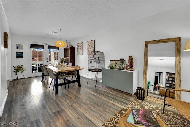4419 Lorna Pl, Las Vegas, NV 89107 - dining space with wood finished floors, french doors, baseboards, and a textured ceiling