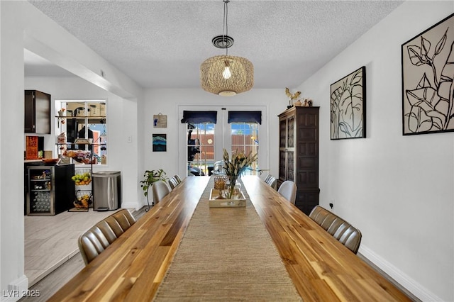 4419 Lorna Pl, Las Vegas, NV 89107 - dining room with a textured ceiling and baseboards