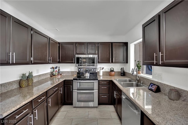4419 Lorna Pl, Las Vegas, NV 89107 - kitchen featuring appliances with stainless steel finishes, a sink, light stone counters, and dark brown cabinetry