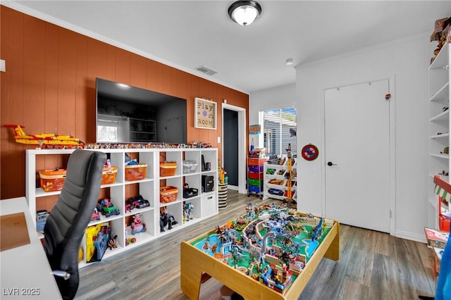 4419 Lorna Pl, Las Vegas, NV 89107 - game room with wood finished floors, ornamental molding, and wooden walls