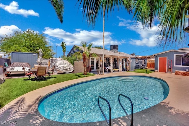 4419 Lorna Pl, Las Vegas, NV 89107 - view of swimming pool with french doors, an outdoor structure, and a patio