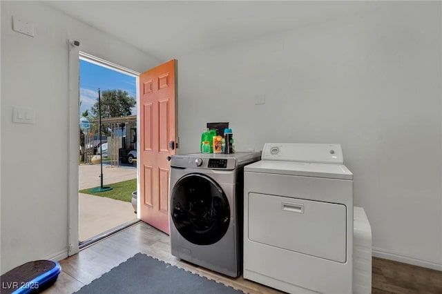 4419 Lorna Pl, Las Vegas, NV 89107 - laundry area featuring washer and dryer and wood finished floors