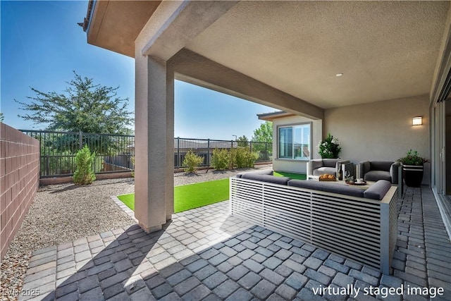 6684 Regency Stone Way, Las Vegas, NV 89148 - fenced backyard featuring an outdoor living space and a patio
