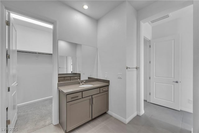 6684 Regency Stone Way, Las Vegas, NV 89148 - bathroom with vanity, baseboards, and tile patterned floors