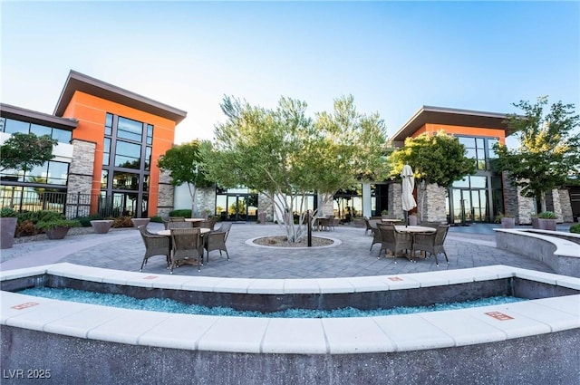 6684 Regency Stone Way, Las Vegas, NV 89148 - surrounding community featuring a patio and outdoor dining space