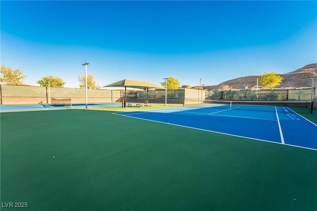 6684 Regency Stone Way, Las Vegas, NV 89148 - view of tennis court with a mountain view