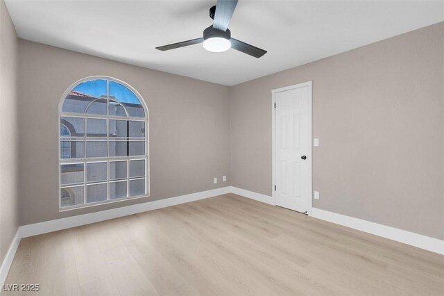 3150 Soft Breezes Dr Unit 2186, Las Vegas, NV 89128 - spare room featuring wood finished floors, baseboards, and ceiling fan