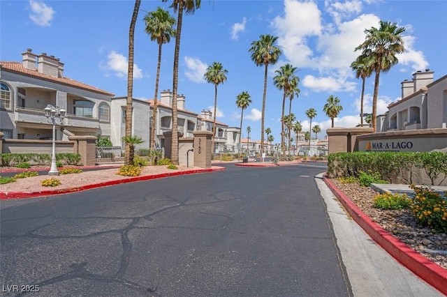 3150 Soft Breezes Dr Unit 2186, Las Vegas, NV 89128 - view of asphalt road featuring a residential view, a gate, and curbs