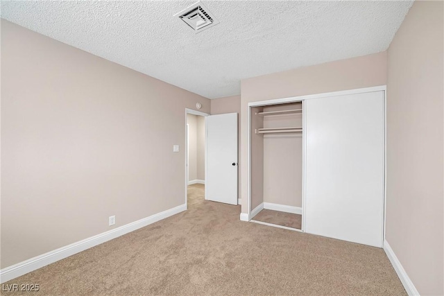 4431 El Campana Way, Las Vegas, NV 89121 - unfurnished bedroom with carpet flooring, a closet, baseboards, and a textured ceiling