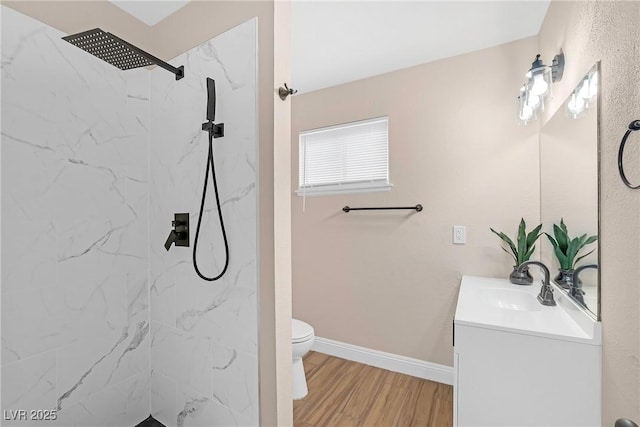 4431 El Campana Way, Las Vegas, NV 89121 - bathroom featuring vanity, toilet, a marble finish shower, wood finished floors, and baseboards