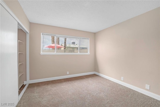 4431 El Campana Way, Las Vegas, NV 89121 - unfurnished bedroom with carpet floors, baseboards, a textured ceiling, and a closet