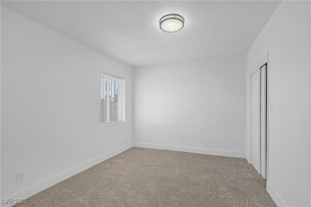 1608 E Mcdonald Ave, North Las Vegas, NV 89030 - unfurnished bedroom with carpet floors, baseboards, and a closet