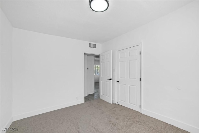 1608 E Mcdonald Ave, North Las Vegas, NV 89030 - unfurnished bedroom featuring carpet floors and baseboards