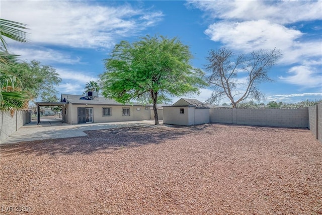 1608 E Mcdonald Ave, North Las Vegas, NV 89030 - back of property with a patio area and a fenced backyard