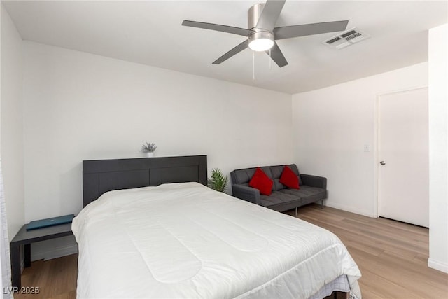 8600 W Charleston Blvd Unit 2085, Las Vegas, NV 89117 - bedroom with wood finished floors, a ceiling fan, and baseboards