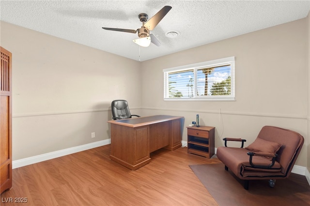 6612 Elton Ave, Las Vegas, NV 89107 - office with light wood finished floors, a ceiling fan, a textured ceiling, and baseboards
