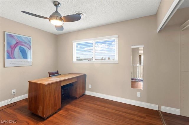 6612 Elton Ave, Las Vegas, NV 89107 - unfurnished office featuring dark wood-style floors, baseboards, a ceiling fan, and a textured ceiling