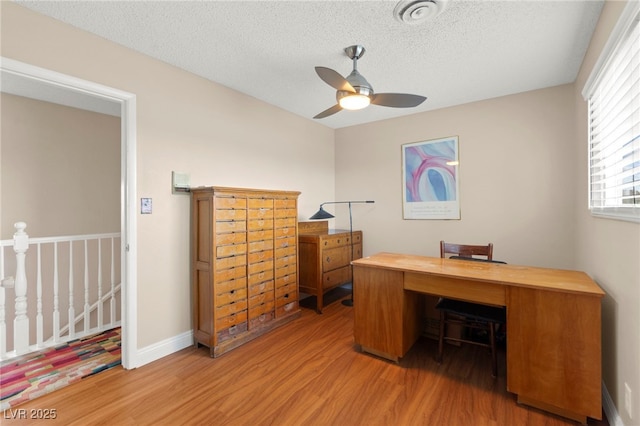 6612 Elton Ave, Las Vegas, NV 89107 - office space with wood finished floors, a ceiling fan, a textured ceiling, and baseboards